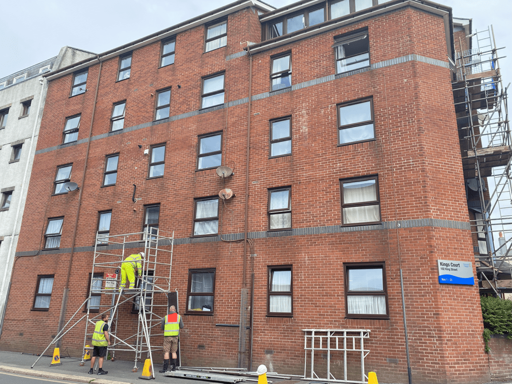 Orbital Cleaning Group's Team Cleaning An Office Block Using Scaffolding And Exterior Cleaning Products